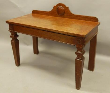 A late Victorian oak serving or hall table