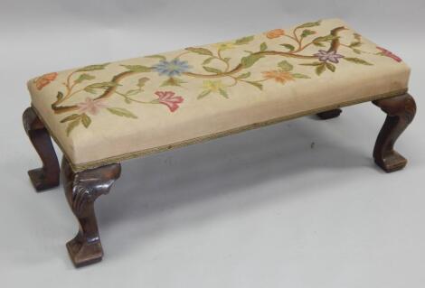 An early 20thC walnut fender type stool