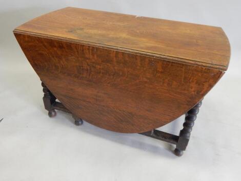 A large oval drop leaf table