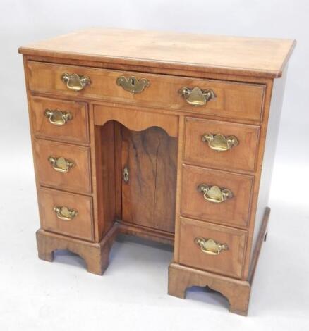 A walnut kneehole desk in mid 18thC style