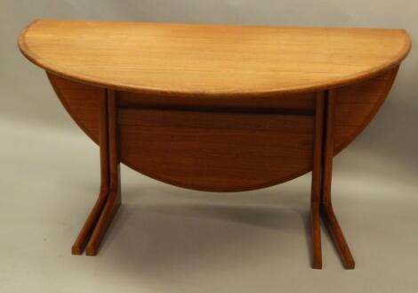 A retro style teak oval drop leaf dining table