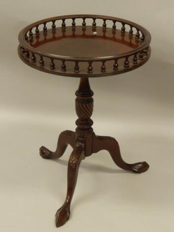 A reproduction mahogany occasional table