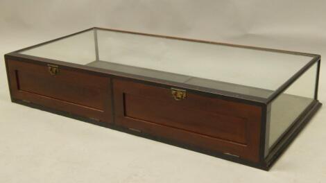 An early 20thC ebonised museum or table top cabinet