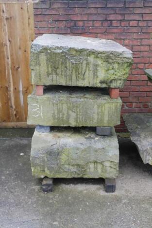 Three square sandstone pad stones