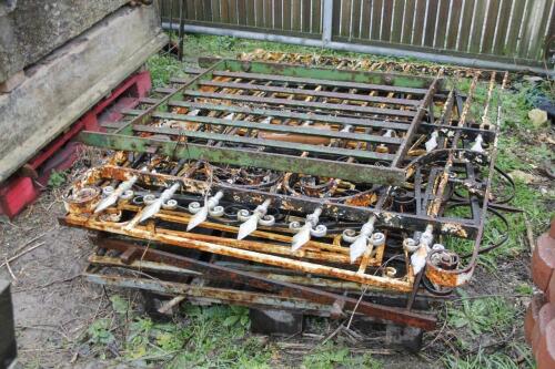 Nine various wrought and cast iron gates and fence sections.