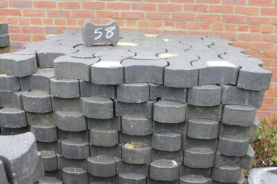 A quantity of heavy duty concrete interlocking pavers.