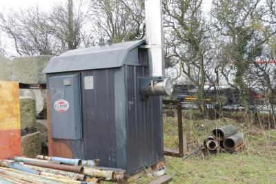 A Classic outdoor wood furnace/boiler. (This lot requires a complete re-wiring). Height not includi