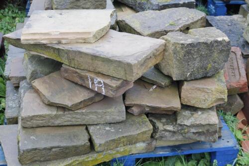 A quantity of sandstone paving and other blocks.