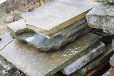 A quantity of sandstone kerbing and blocks.