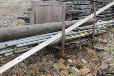 A quantity of scaffolding poles