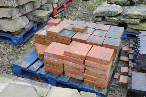 A quantity of terracotta pavers.