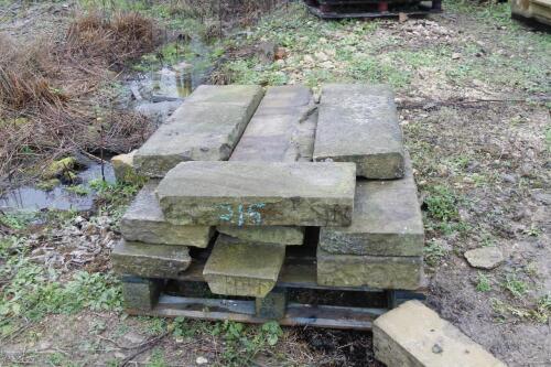 A quantity of sandstone kerbing.