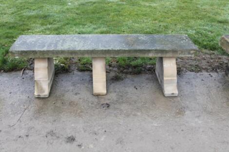 A rustic sandstone bench