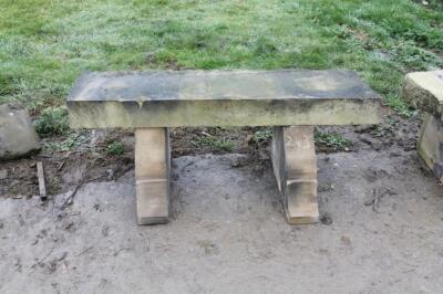 A rustic sandstone bench