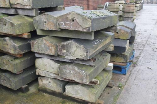 Eight granite coping blocks.