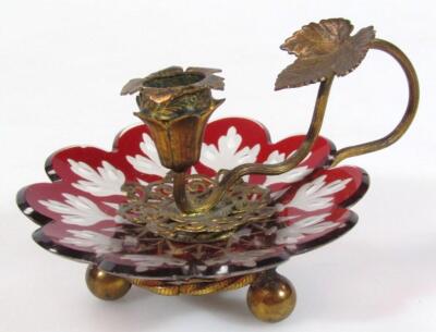 An early 20thC ruby and frosted glass gilt metal candlestick