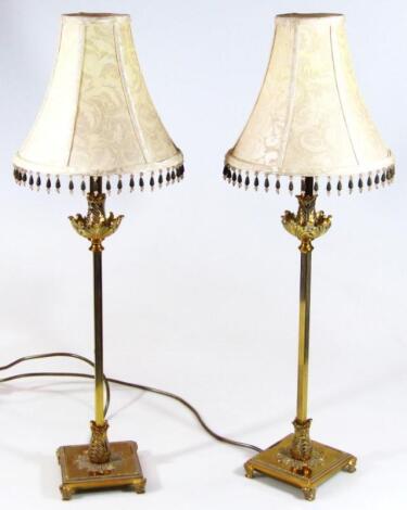 A pair of modern brass table lamps