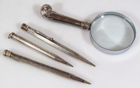 Three various silver cased propelling pencils