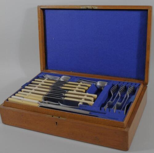 An oak cased canteen of silver plated cutlery