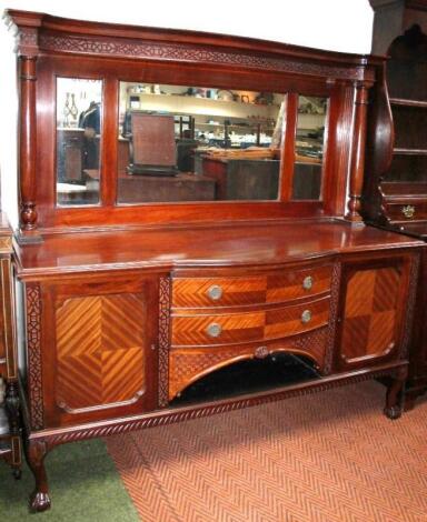 An Edwardian mahogany and walnut mirror back sideboard