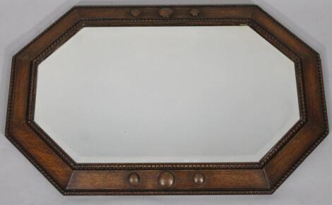 A 20thC oak framed mirror