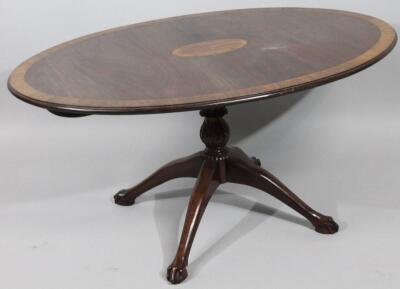 A 20thC mahogany snap top occasional table