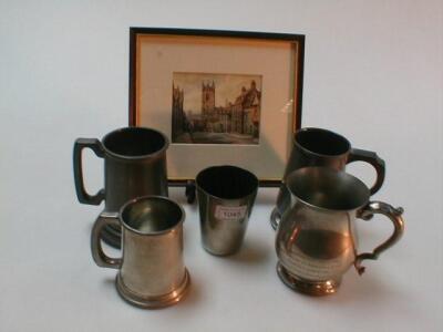 A 19thC pewter beaker and four pewter tankards