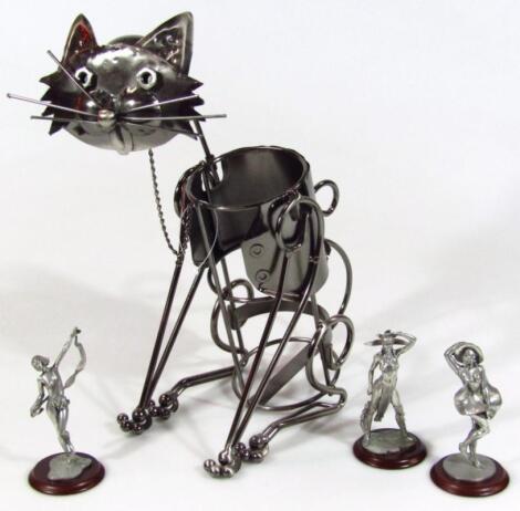 A modern bent metal bottle stand formed as a cat