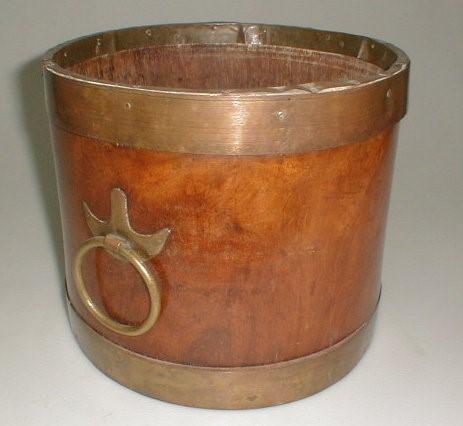 A mahogany brass bound drum shape bucket