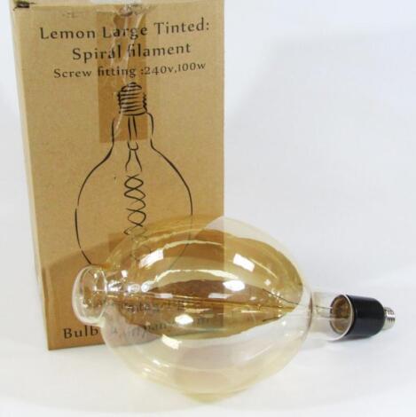 A large lemon tinted glass bulb