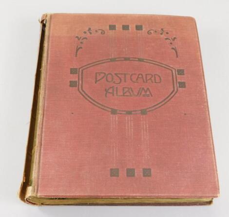 An album containing a collection of Edwardian postcards