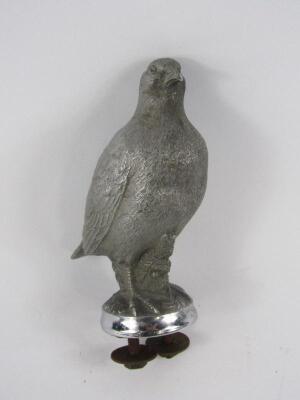 A matt cast metal car mascot modelled as a grouse
