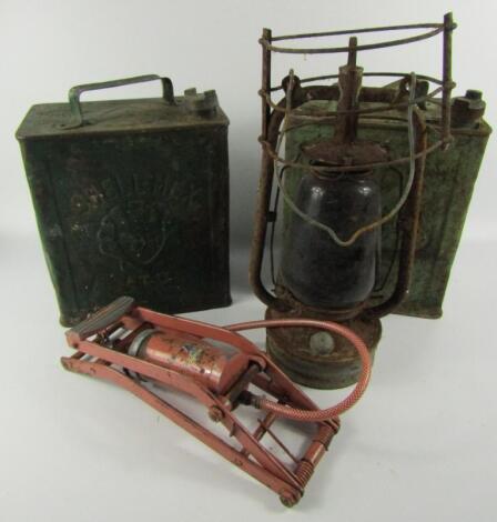 A pair of Shell petrol cans