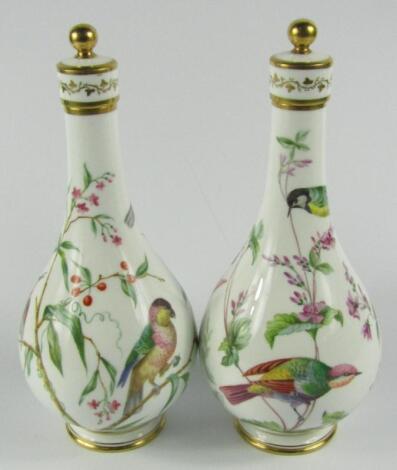 A pair of Minton porcelain mid 19thC bottle vases and covers