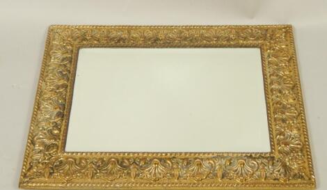 An early 20thC brass framed wall mirror