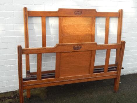 An Art Nouveau oak double bed