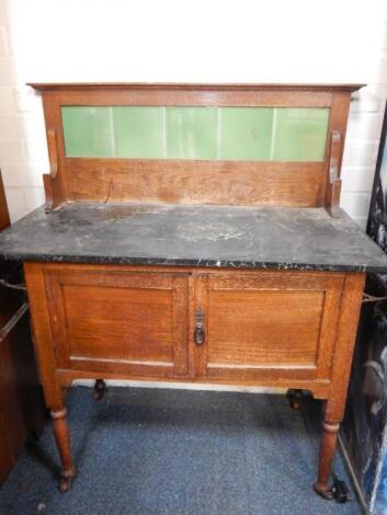 A Victorian oak and black marble topped wash stand