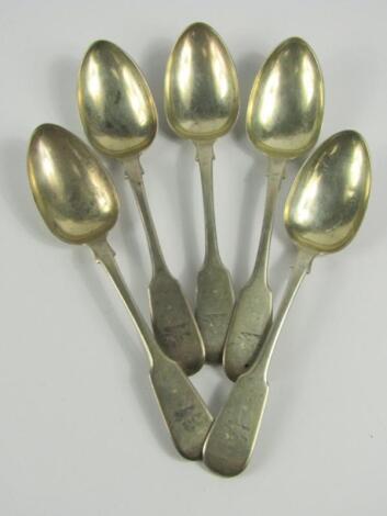 A set of five William IV crested silver fiddle pattern dessert spoons