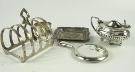 A miniature silver hand mirror