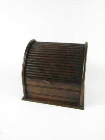 A late 19thC oak tambour stationery rack