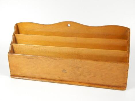 A Winel light oak stationery rack