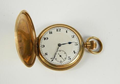 A gold plated gentleman's hunter cased pocket watch, keyless wind, enamel dial bearing Arabic numerals, subsidiary seconds dial, Swiss movement, case with engine turned decoration, shield reserve.