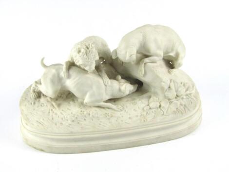 A late 19thC Parian figure group of hounds and a terrier