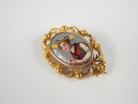 A 19thC oval painted enamel portrait brooch