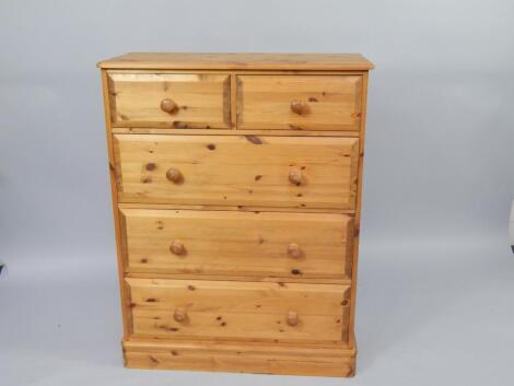 A pine chest of drawers