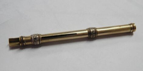 A rolled gold retractable ink pen and pencil by Perry and Co.