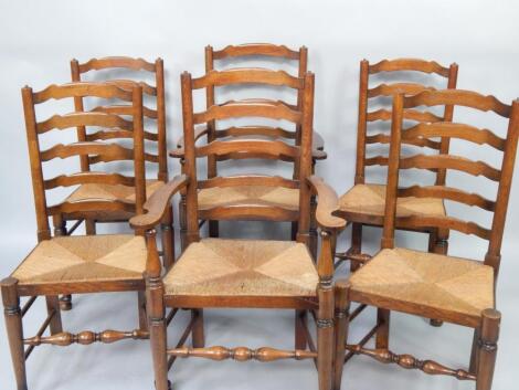 A set of six oak ladderback dining chairs with rush seats