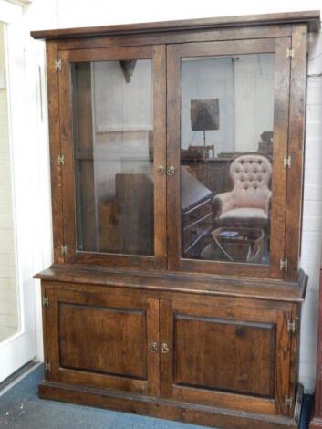 An oak cupboard bookcase