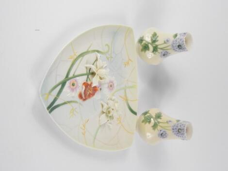 A Franz Porcelain triangular plate decorated in the Enchanted Garden Pattern