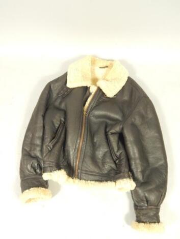 A gentleman's brown leather jacket with sheepskin lining.